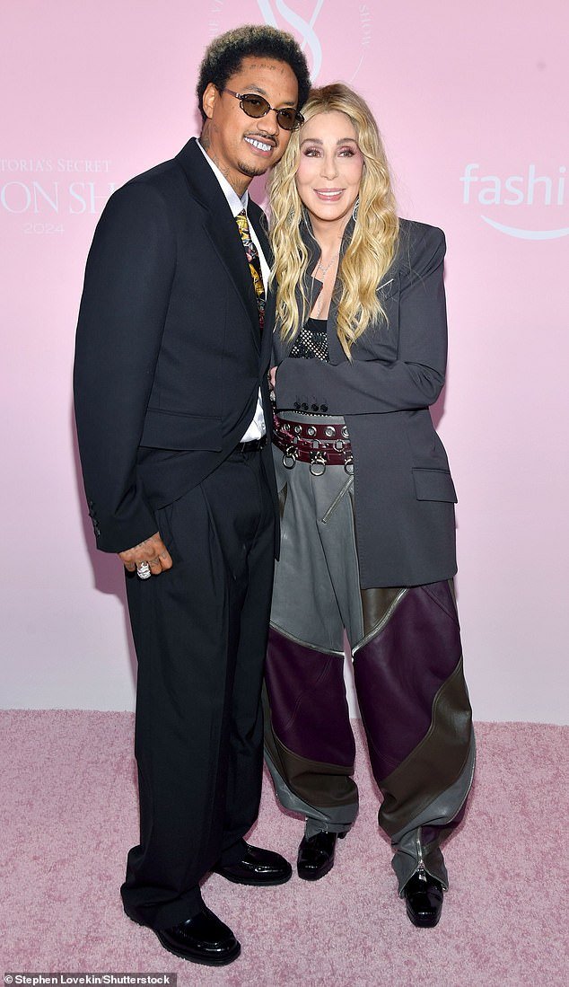 Cher was joined by longtime beau Alexander 'AE' Edwards on the Victoria's Secret red carpet on Tuesday night