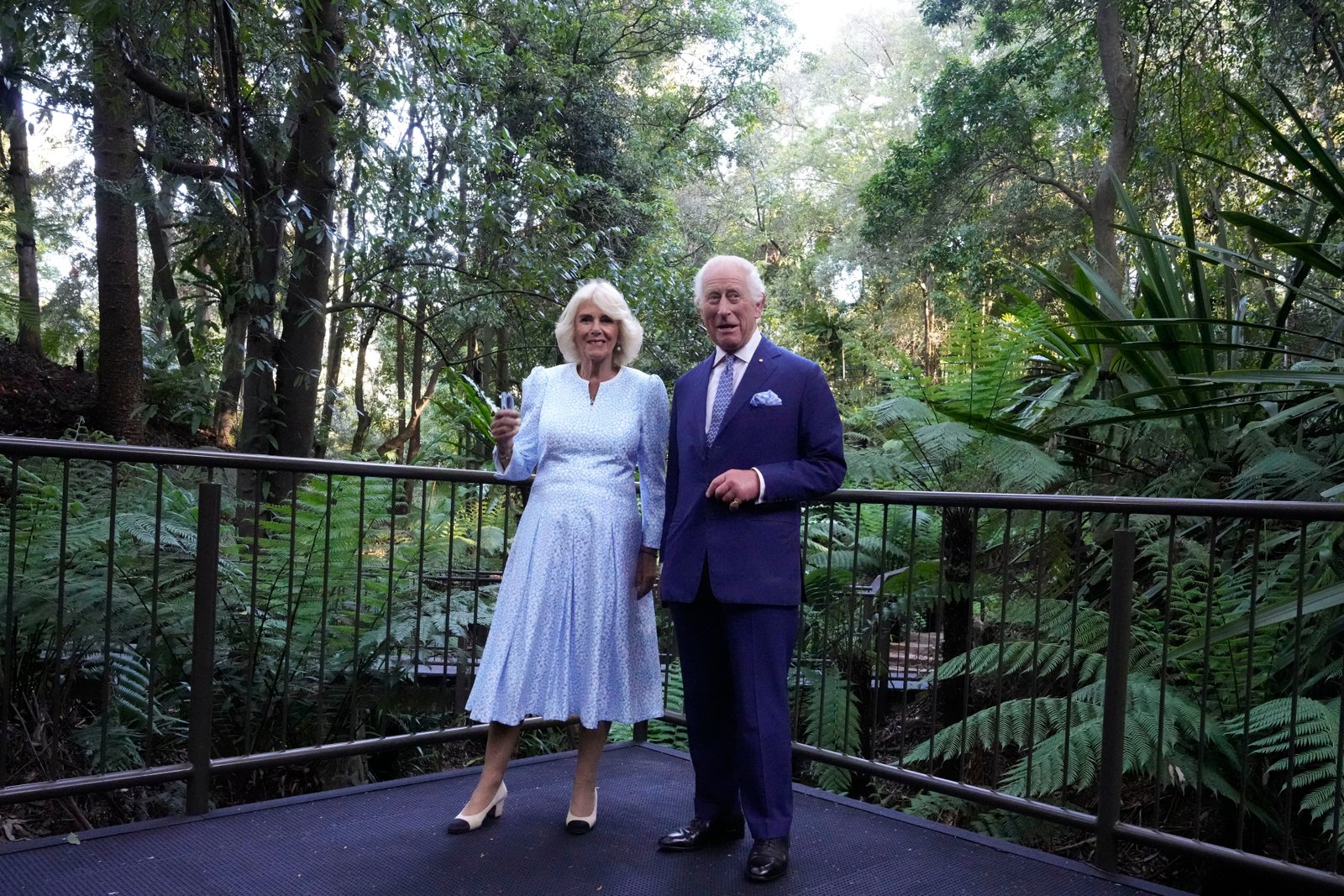 Britain's King Charles III, and Queen Camilla, cats as they walk through the rainforest canyon at the Australian National Botanic Gardens in Canberra,