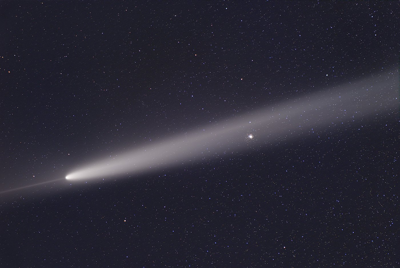 a bright white, blurred streak in the night sky