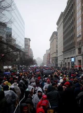 Supporters of US President-elect Donald Trump gather outside the Capital One Arena in downtown Washington, DC, for a rally a day before he is scheduled to be inaugurated for a second term