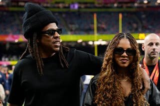 Jay-Z and his daughter Blue Ivy Carter, on the right, are seen on the sidelines before the NFL Super Bowl 59 football match between Kansas City Chiefs and Philadelphia Eagles, Sunday 9 February 2025 in New Orleans