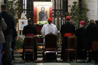 Cardinal Baldassare Reina (Center) celebrating a rosary on the steps of the Basilica of Santa Maria Maggiore to honor Pope Francis Download