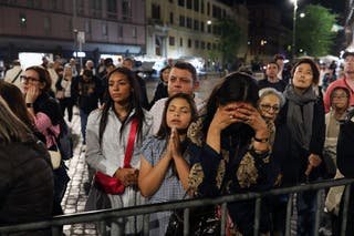 Faithfully waiting for a rosary celebrated on the steps of the basilica of Santa Maria Maggiore to honor Pope Francis