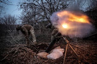 Ukrainian soldiers fire 120 mm mortar against Russian army positions near Chasiv Yar in Donetsk -Region