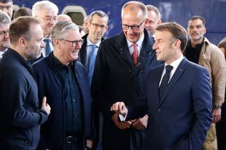 France's President Emmanuel Macron (R), Britain's Prime Minister Keir Stormer (L) and Germany's Chancellor Friedrich Merz (C) arrive at Kyiv Railway Station on May 10, 2025, in front of a collection of European leaders in the unkind capital. The leaders of the UK, France, Germany and Poland visit an unprecedented joint visit to Kiev on May 10, 2025 for conversations with Ukraine President Volodymyr and urge Russia to agree on a ceasefire