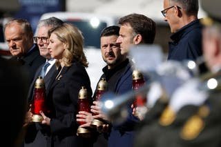(From l) Poland's Prime Minister Donald Tusk, UK Prime Minister Keir Stormer, Olena Zelenska, Ukraine's President Volodymyr Zelensky, France President Emmanuel Macron and Germany's Chancellor Friedrich Merz pay their respect for the victims of the war at the memorial of the disability.
