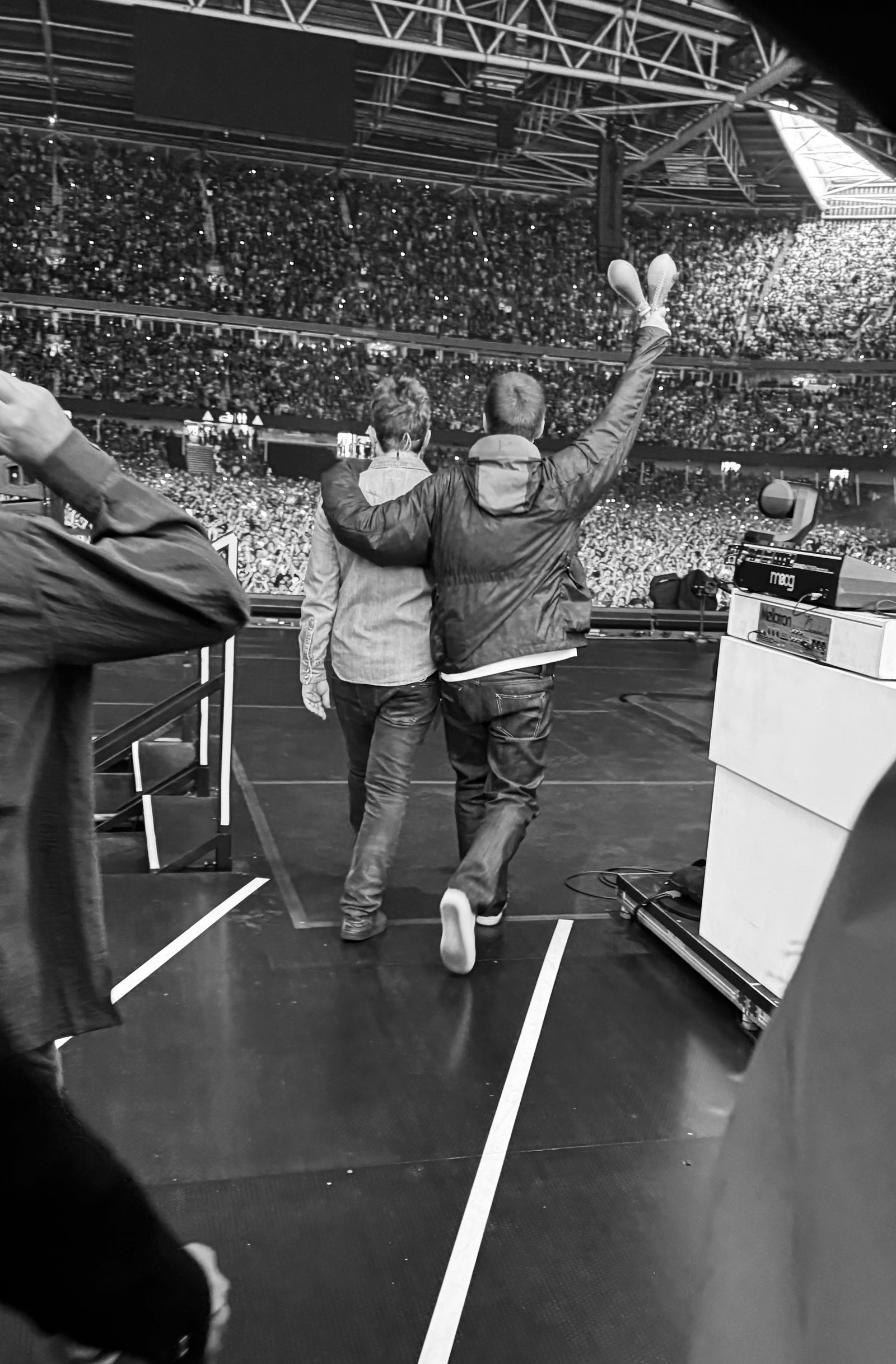 Noel and Liam Gallagher arrive on stage at the Principality Stadium in Cardiff, July 4, 2025
