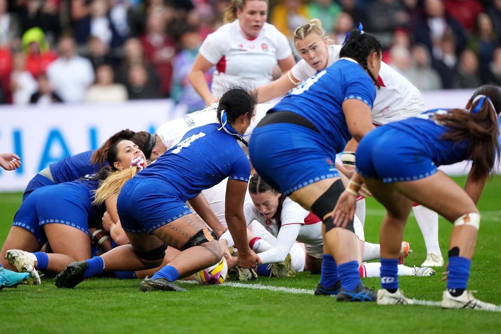 Lucy Packer is forcing his way across the line