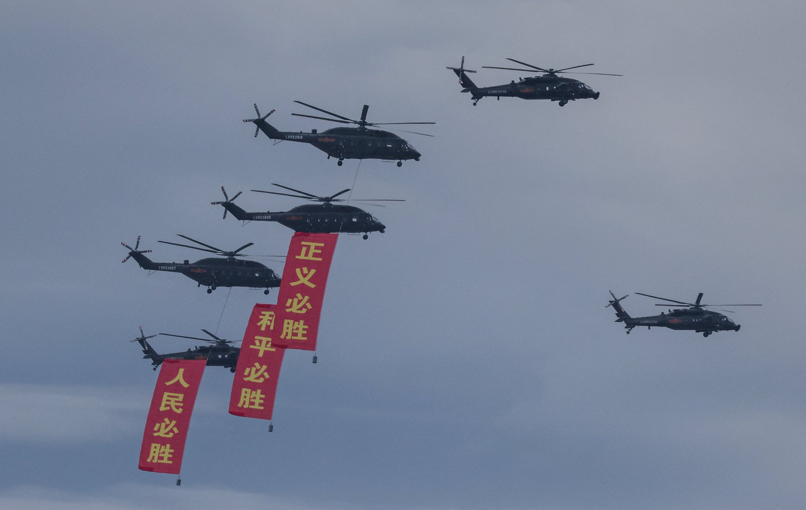 Chinese Changhe Z-8L and Harbin Z-20 Helicopters fly in Formation during a Flypast General Test
