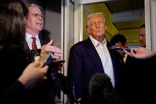 Scott Bessent, the US Treasury Secretary, and President Donald Trump speak to reporters